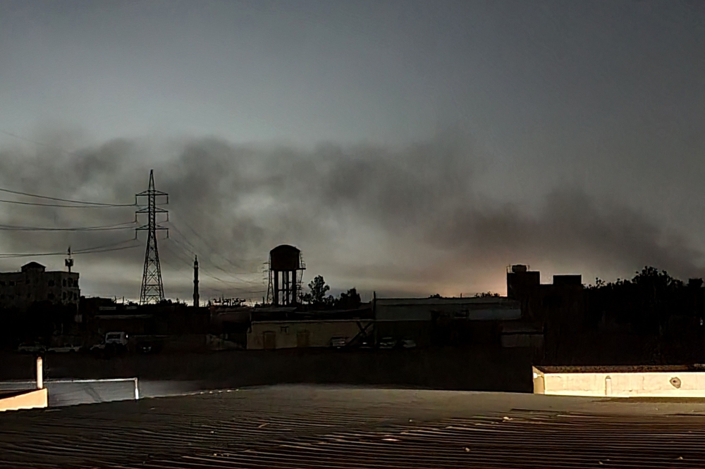 Smoke billows in Khartoum amid ongoing fighting between the forces of two rival generals, on May 11, 2023. (Photo by AFP)
