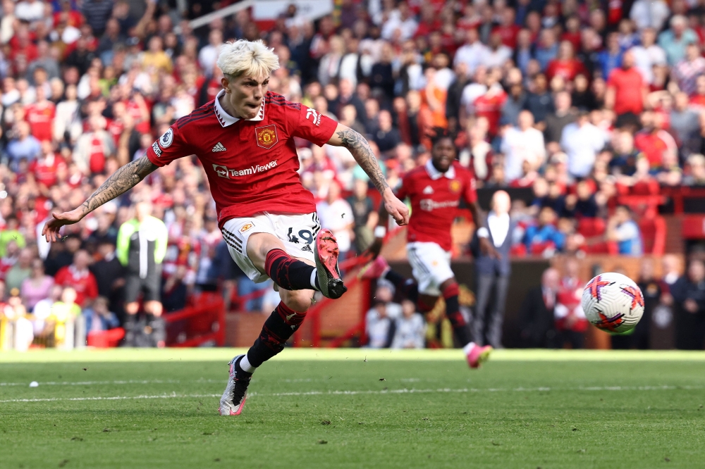 Manchester United's Argentinian midfielder Alejandro Garnacho scores his team's second goal during the English Premier League football match between Manchester United and Wolverhampton Wanderers at Old Trafford in Manchester, north west England, on May 13, 2023. (Photo by DARREN STAPLES / AFP)
