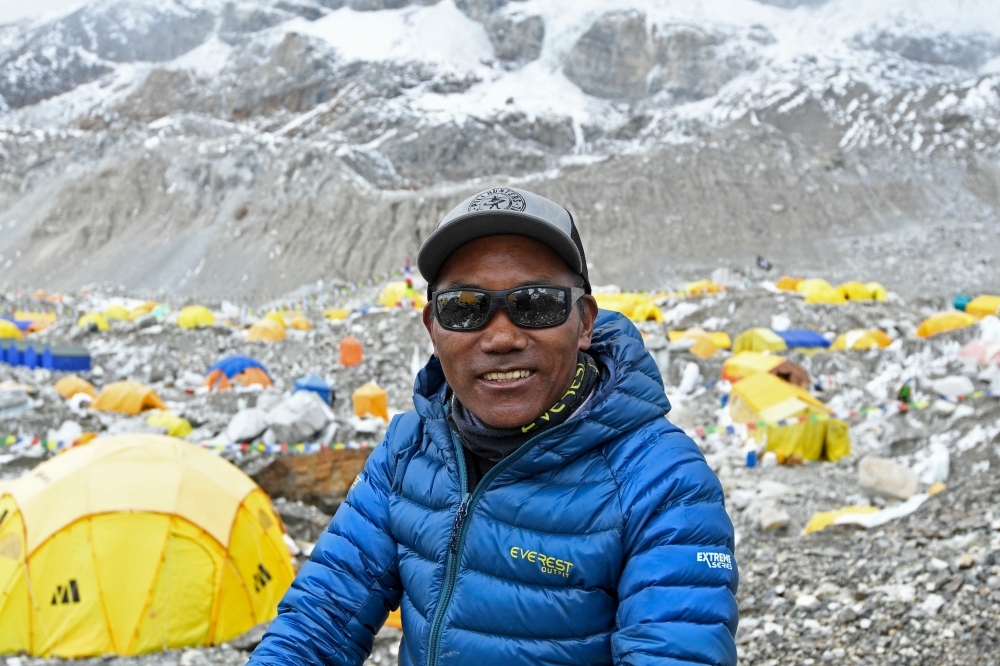 In this file photo taken on May 2, 2021, Nepal's mountaineer Kami Rita Sherpa poses for a picture at the Everest base camp in the Mount Everest region of Solukhumbu district. (Photo by Prakash Mathema / AFP)