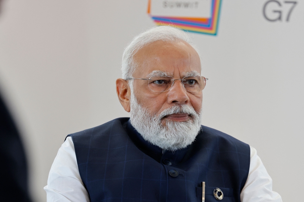 India's Prime Minister Narendra Modi attends a bilateral meeting with France's President Emmanuel Macron (not pictured) on the sidelines of the G7 Leaders' Summit in Hiroshima on May 20, 2023. (Photo by Ludovic Marin / POOL / AFP)