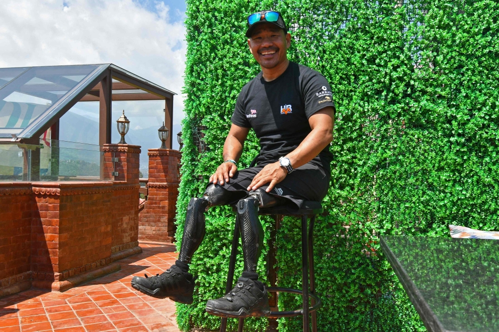 In this file photo taken on April 3, 2023, Gurkha veteran Hari Budha Magar poses during an interview with AFP in Kathmandu. (Photo by Prakash Mathema / AFP)