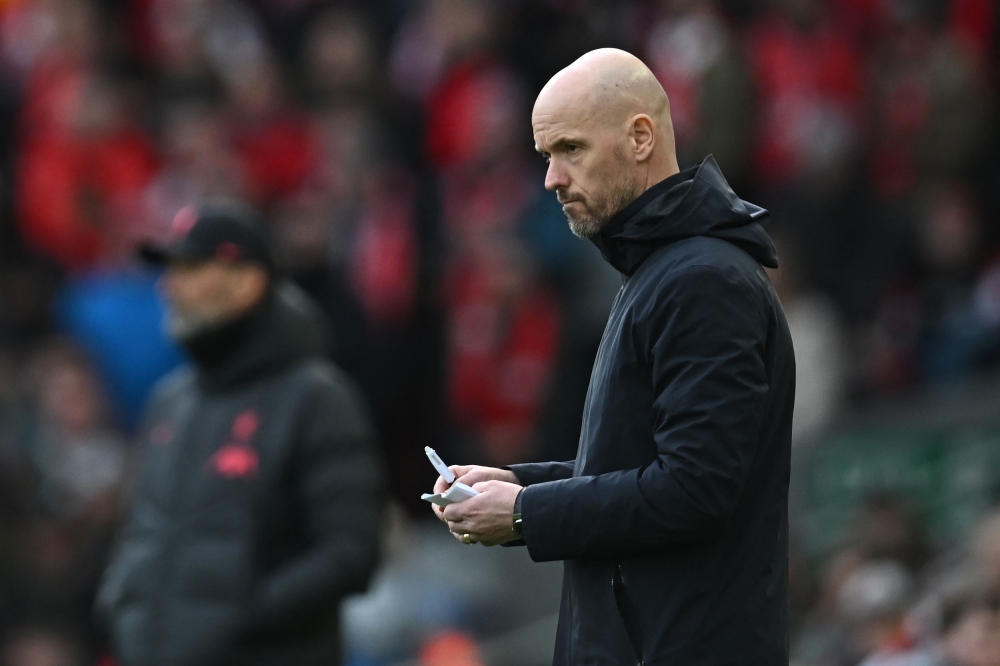File photo: Manchester United's Dutch manager Erik ten Hag makes notes during the English Premier League match between Liverpool and Manchester United at Anfield in Liverpool, north west England on March 5, 2023. (Photo by Paul ELLIS / AFP)