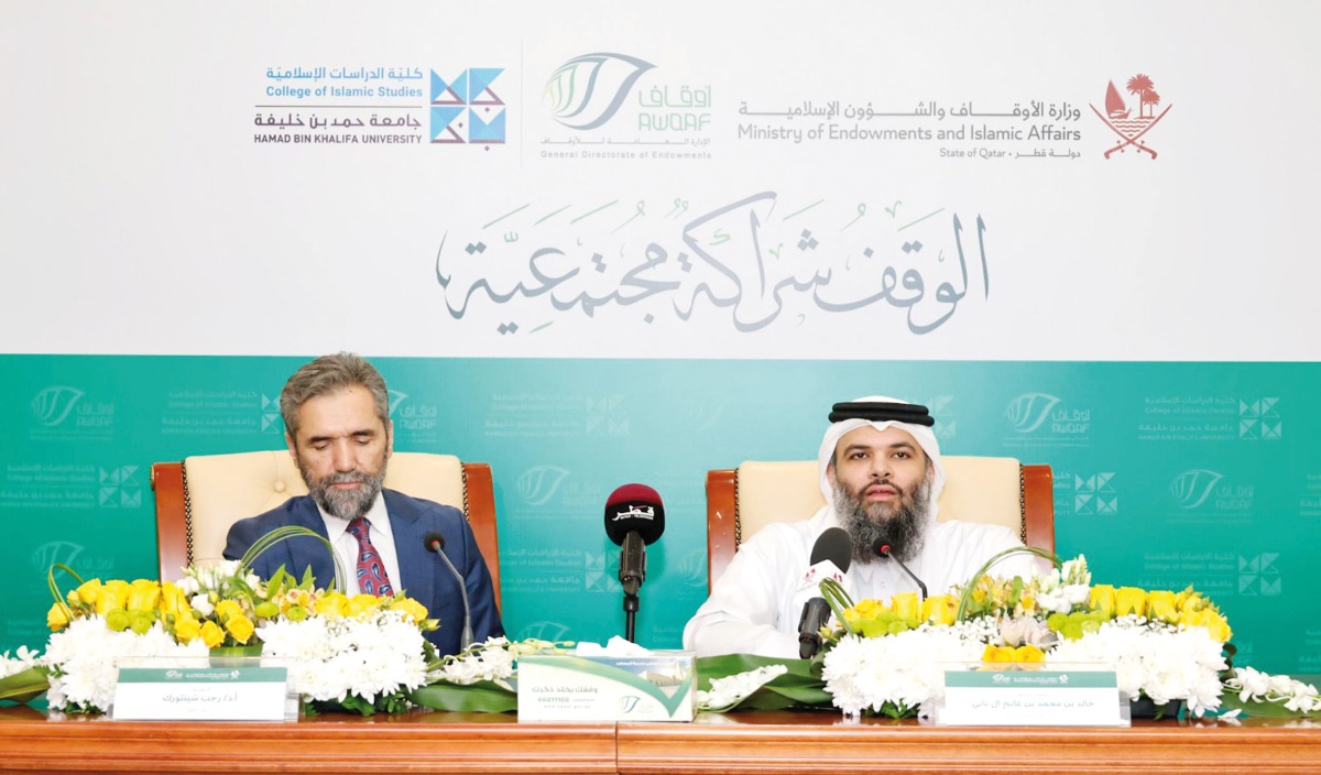 Director-General of General Endowment Department Dr. Sheikh Khalid bin Mohammed bin Ghanem Al Thani and Dean of the College of Islamic Studies of HBKU Dr. Recep Senturk addressing a press conference at the headquarters yesterday.