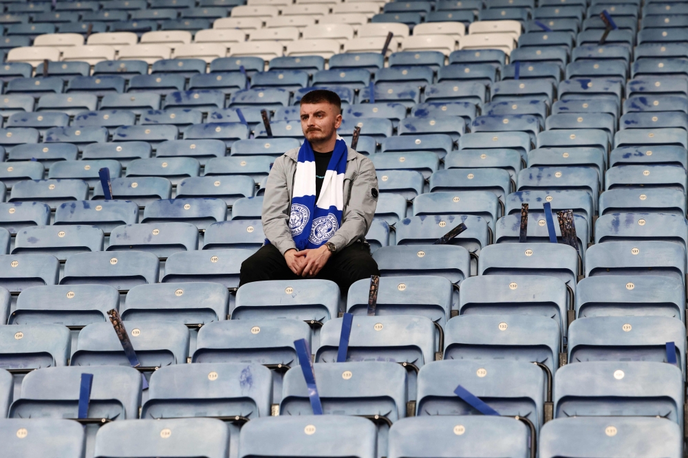 A Leicester City's fan reacts at the end of the English Premier League football match between Leicester City and West Ham United at King Power Stadium in Leicester, central England on May 28, 2023. (Photo by Darren Staples / AFP) 