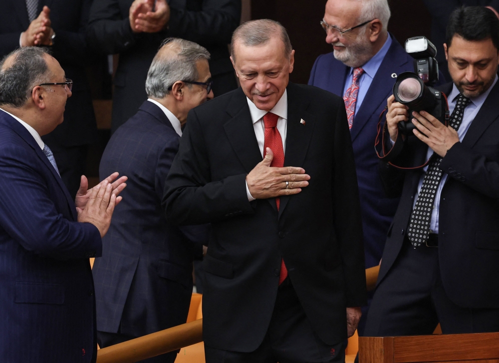 Turkish President Recep Tayyip Erdogan gestures while he attends the 28th term deputies' oath-taking ceremony at the Turkish Grand National Assembly in Ankara, Turkey on June 02, 2023. (Photo by Adem Altan / AFP)
