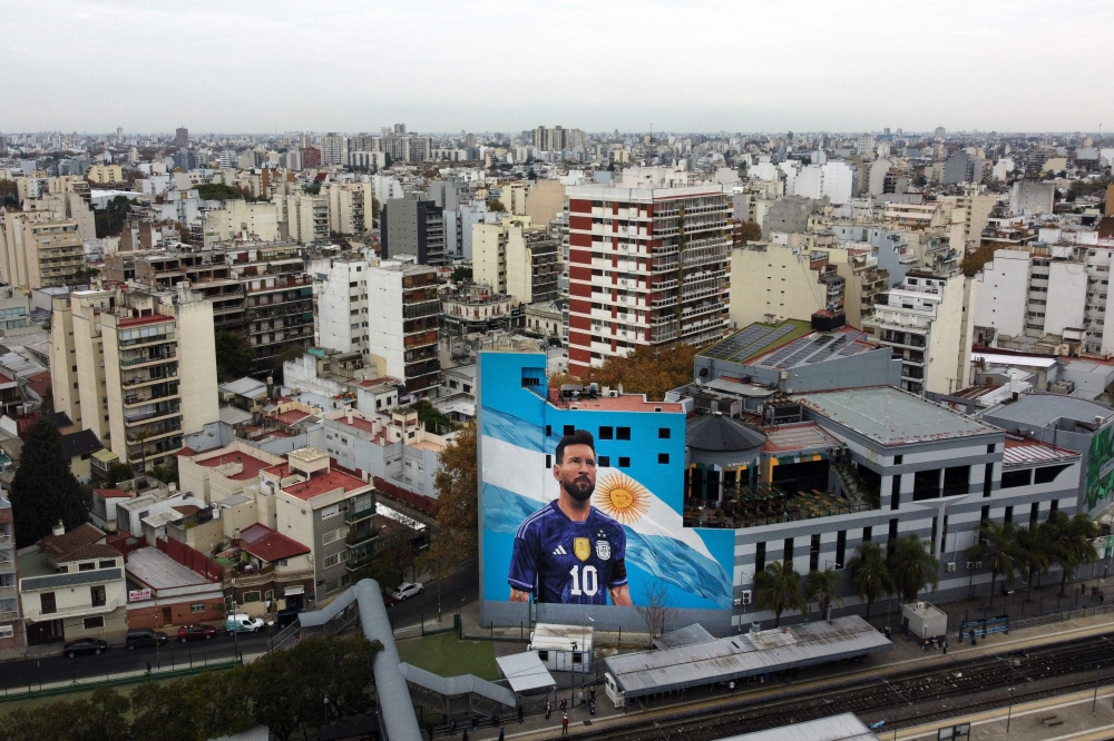 Aerial view of a mural painting depicting Argentine football star Lionel Messi at the Villa del Parque train station in Buenos Aires taken on June 6, 2023 (Photo by Luis Robayo / AFP)