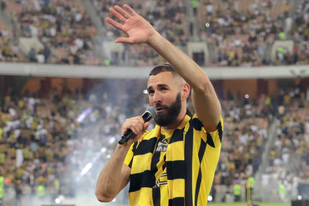 French forward Karim BENZEMA greets the crowd during his unveiling at King Abdullah Sports City stadium in Jeddah, on June 8, 2023. (Photo by AFP)