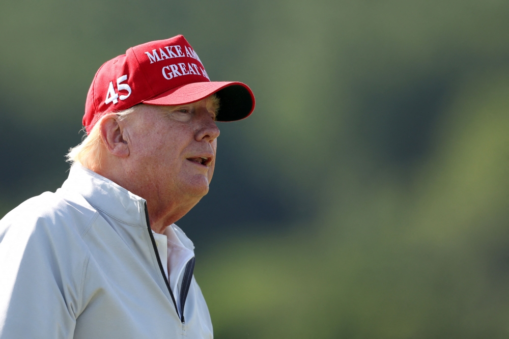 Former US President Donald Trump looks on while playing in the pro-am prior to the LIV Golf Invitational - DC at Trump National Golf Club on May 25, 2023 in Sterling, Virginia. Rob Carr/Getty Images/AFP