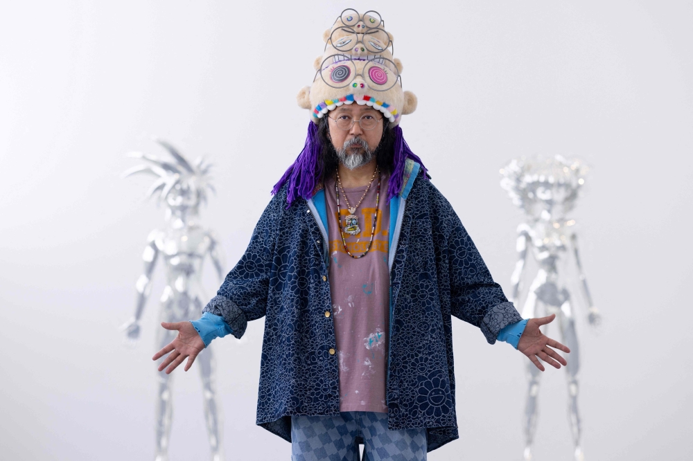 Murakami poses during a photo session at the Gagosian Gallery in Le Bourget, outside Paris, on June 8, 2023. (Photo by JOEL SAGET / AFP)