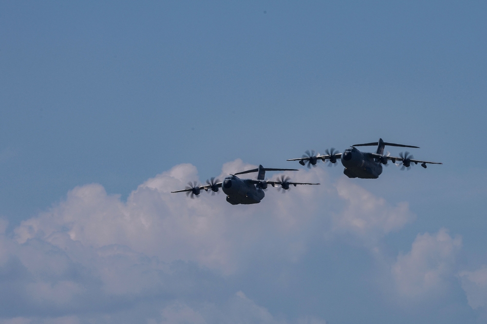 Two Airbus A400M military aircrafts of the German Armed Forces Bundeswehr approach during the Air Defender Exercise 2023 in the military air base in Wunstorf, northern Germany, on June 12, 2023. (Photo by Ronny Hartmann / AFP)