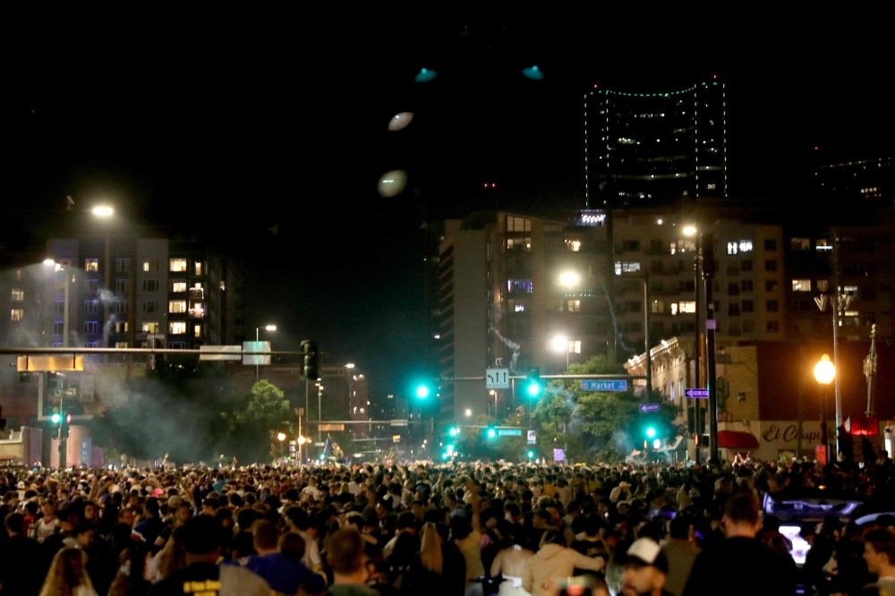 Denver Nuggets fans celebrate in downtown Denver after the end of Game Five of the 2023 NBA Finals at Ball Arena on June 12, 2023 in Denver, Colorado. Max Paro/Getty Images/AFP  