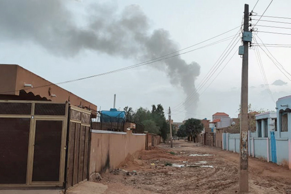File photo: Smoke billows in the distance amid ongoing fighting in Khartoum on June 13, 2023. (Photo by AFP)
