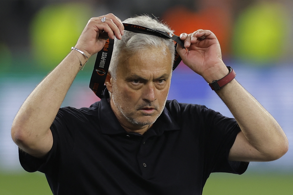 File photo: AS Roma's Portuguese coach Jose Mourinho takes off his runners-up medal after the UEFA Europa League final football match between Sevilla FC and AS Roma at the Puskas Arena in Budapest on May 31, 2023. AS Roma's Portuguese coach Jose Mourinho given four-match ban for insulting referee (Photo by Odd ANDERSEN / AFP)