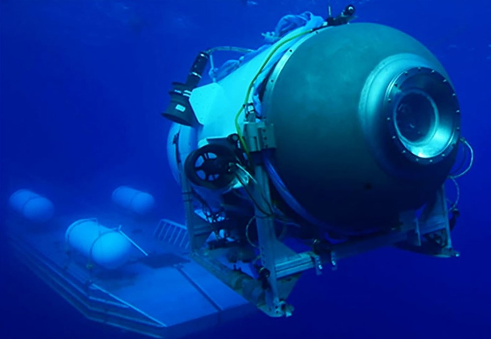 This undated image courtesy of OceanGate Expeditions, shows their Titan submersible launching from a platform. (Photo by Handout / OceanGate Expeditions / AFP)

