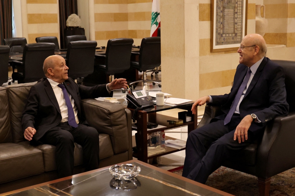 Lebanese caretaker Prime Minister Najib Mikati (right) meets with France's new special envoy for Lebanon Jean-Yves Le Drian, in Beirut on June 22, 2023. (Photo by Anwar Amro / AFP)