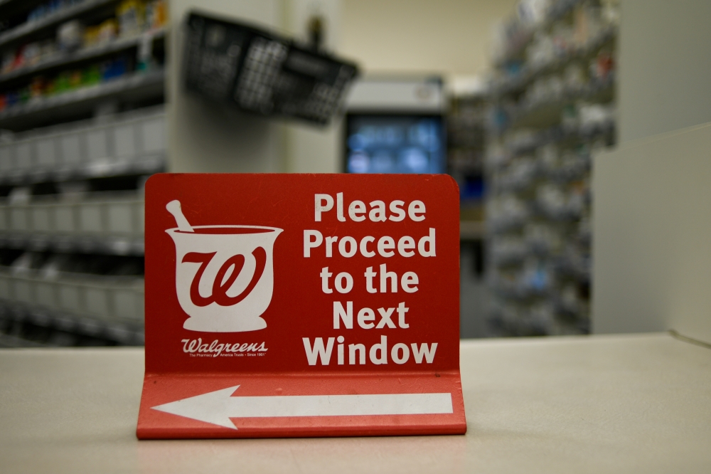 A sign rests on a counter at a Walgreens pharmacy store in Austin, TX, US, March 26, 2018. Reuters/Mohammad Khursheed

