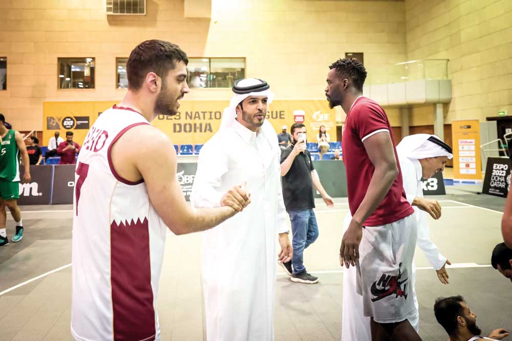 Qatar Basketball Federation (QBF) President Mohamed Saad Al Mughaiseeb congratulates Qatar players.