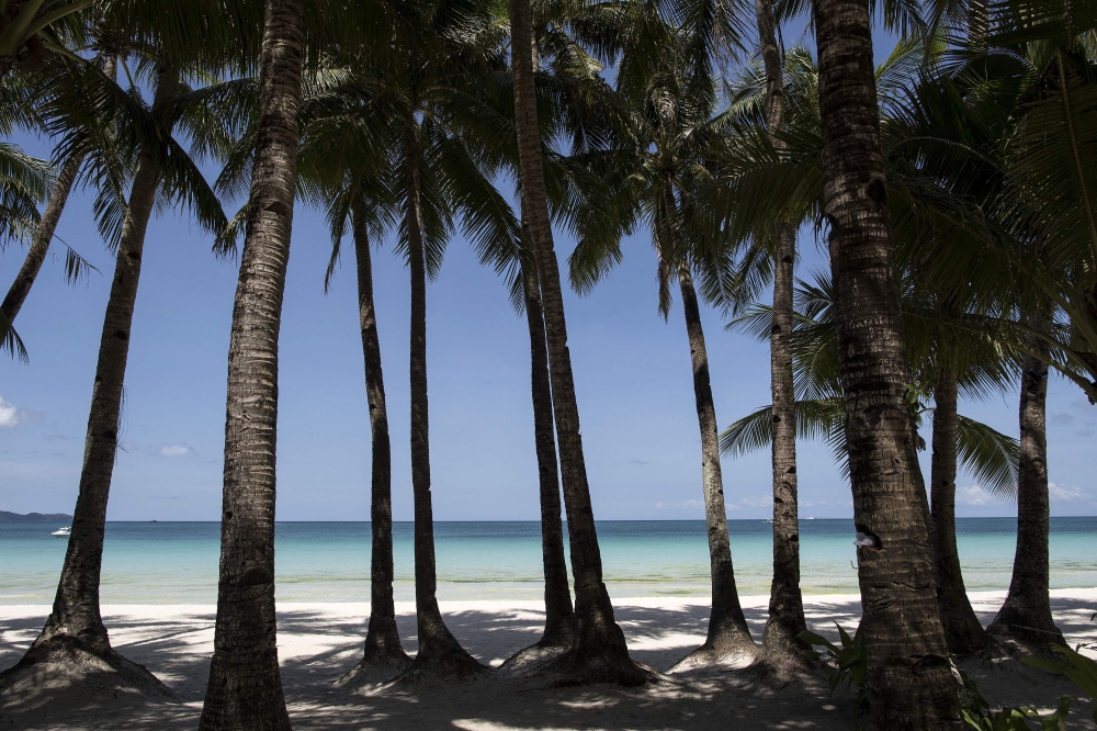 (FILES) A general view shows an empty beach on the Philippine island of Boracay on April 26, 2018. (Photo by NOEL CELIS / AFP)
