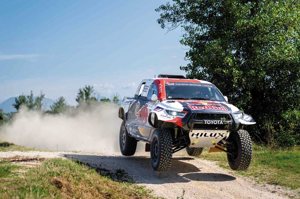 Qatar's Nasser Saleh Al Attiyah competes during the Italian Baja. INSET: Al Attiyah after finishing a stage. 