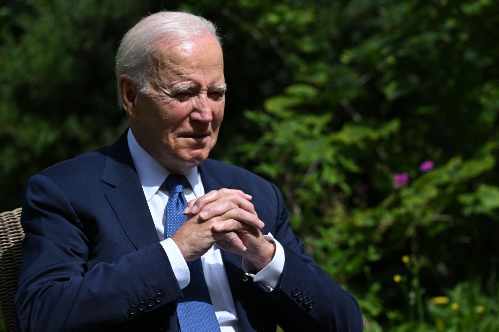 US President Joe Biden reacts as he talks with Britain's Prime Minister Rishi Sunak and in the garden of 10 Downing Street in central London on July 10, 2023, during their meeting. Photo by ANDREW CABALLERO-REYNOLDS / AFP