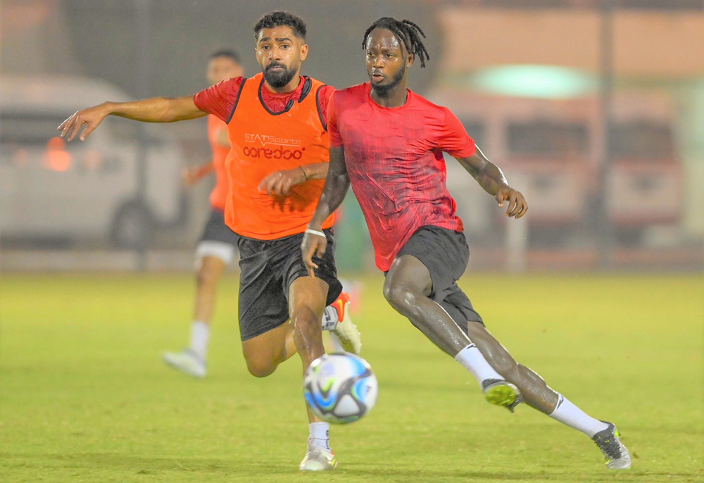 Al Markhiya players in action during a training session.