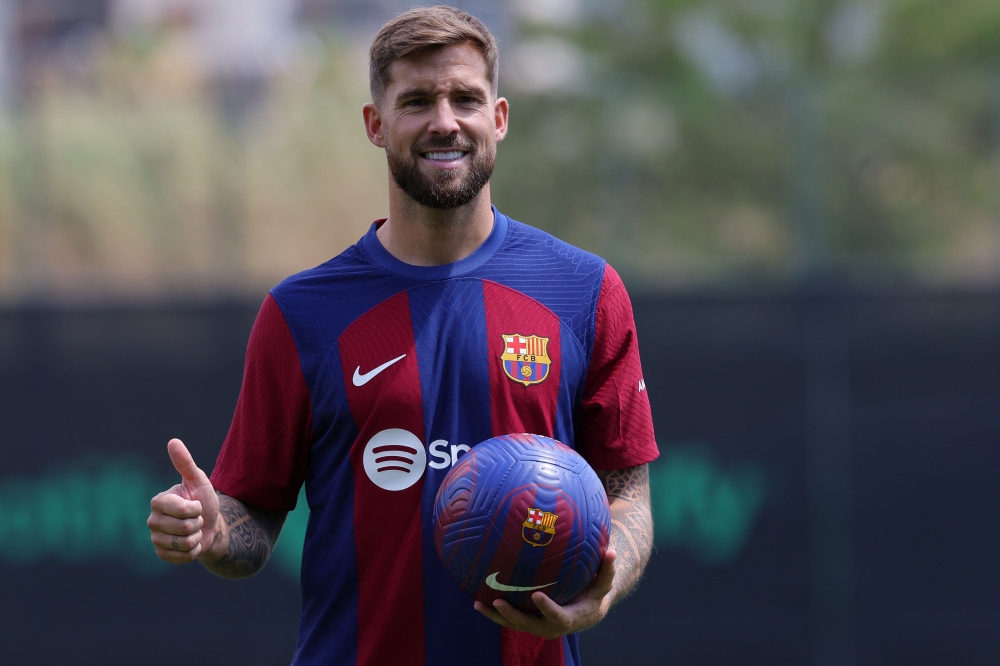 FC Barcelona's newly signed Spanish defender Inigo Martinez poses for pictures during his official presentation at the Joan Gamper training ground in Sant Joan Despi on July 13, 2023. Photo by LLUIS GENE / AFP