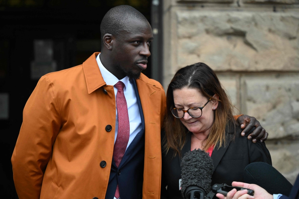 French footballer Benjamin Mendy stands with his solicitor outside Chester Crown Court in Chester, north-west England, on July 14, 2023, having been cleared of one count of rape and another of attempted rape. (Photo by Oli SCARFF / AFP)

