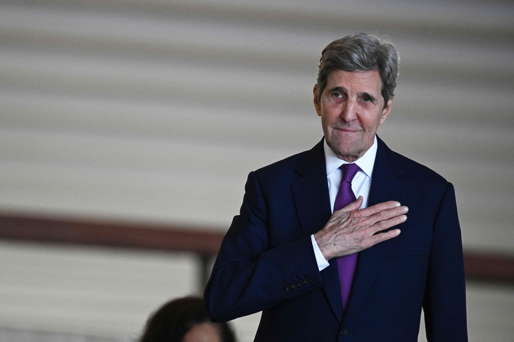(Files) US Special Presidential Envoy for Climate John Kerry gestures as he arrives to the Itamaraty Palace in Brasilia to meet Brazilian Vice President Geraldo Alckmin and Minister of Environment Marina Silva, on February 27, 2023. (Photo by Evaristo SA / AFP)
 