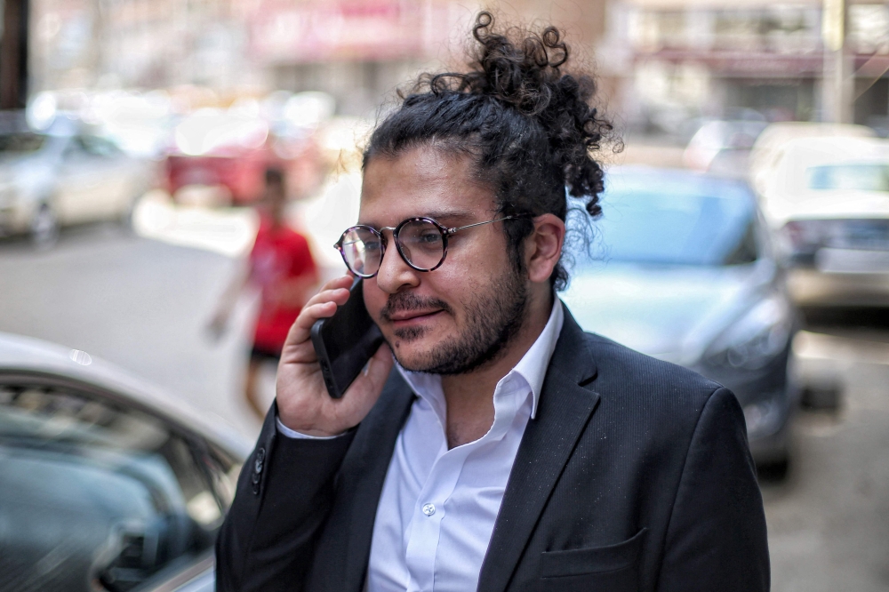 (FILES) Egyptian researcher Patrick Zaki arrives at a courthouse in Egypt's northern Nile delta city of Mansoura for a trial hearing on June 21, 2022. (Photo by Mohamed EL-RAAI / AFP)

