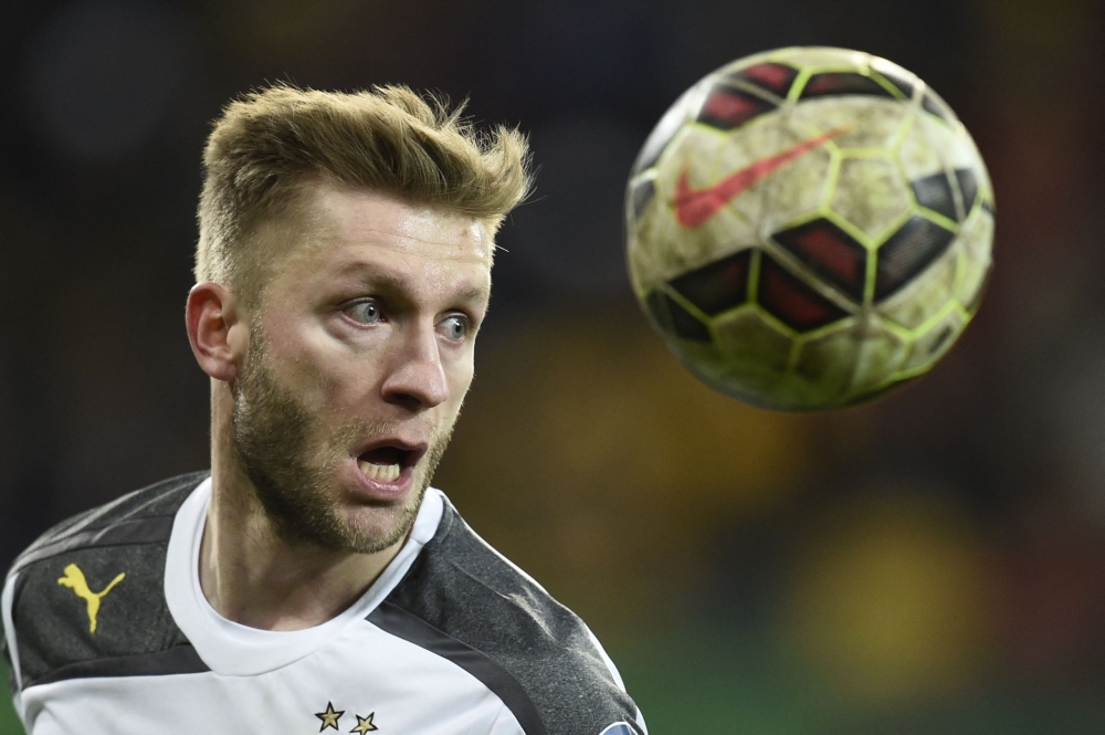 Dortmund's Polish midfielder Jakub Blaszczykowski heads the ball during the German football Cup DFB round of 16 game between German third division Dynamo Dresden and first Bundesliga Borussia Dortmund, in Dresden eastern Germany, on March 3, 2015. Photo by Odd ANDERSEN / AFP