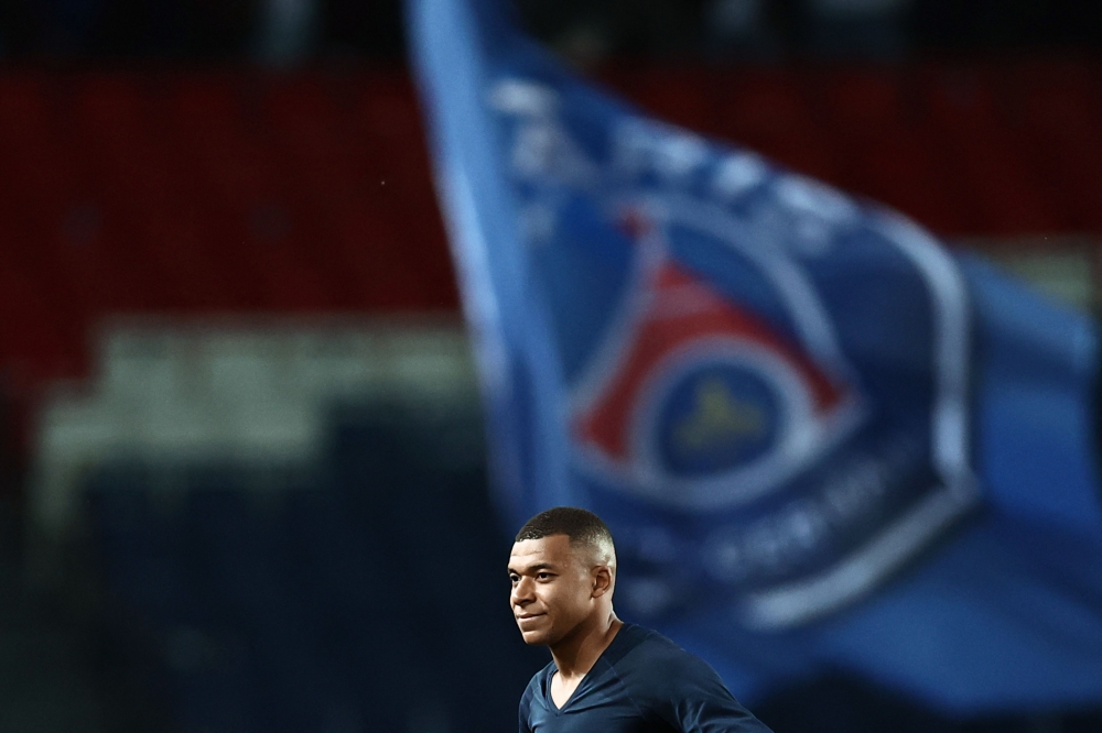 Paris Saint-Germain's French forward Kylian Mbappe is seen at the end of the French L1 football match between Paris Saint-Germain (PSG) and Ajaccio at the Parc des Princes in Paris, on May 13, 2023. Photo by Anne-Christine POUJOULAT / AFP