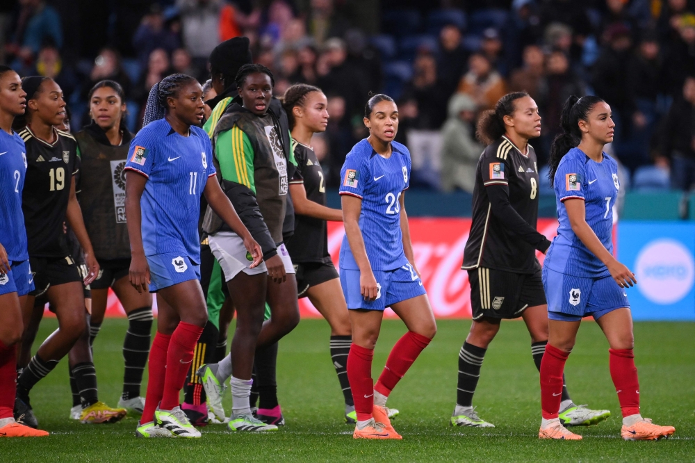France and Jamaica players walk off the pitch after the final whistle of the Australia and New Zealand 2023 Women's World Cup Group F football match between France and Jamaica at Sydney Football Stadium in Sydney on July 23, 2023. (Photo by FRANCK FIFE / AFP)
