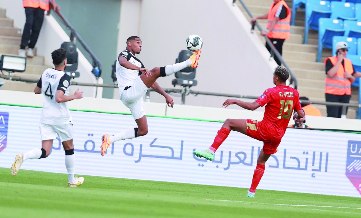 Qatar's Pedro Miguel (left) and Wydad's Montasser Lahtimi in action.