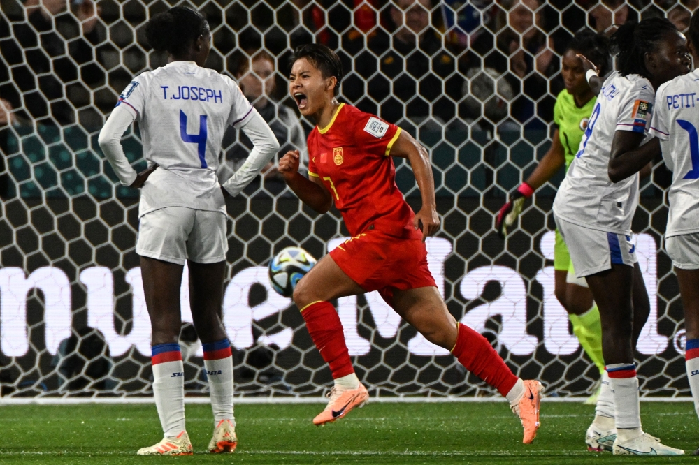 China's forward #07 Wang Shuang (C) celebrates scoring her team's first goal during the Australia and New Zealand 2023 Women's World Cup Group D football match between China and Haiti at Hindmarsh Stadium in Adelaide on July 28, 2023. (Photo by Brenton EDWARDS / AFP)

