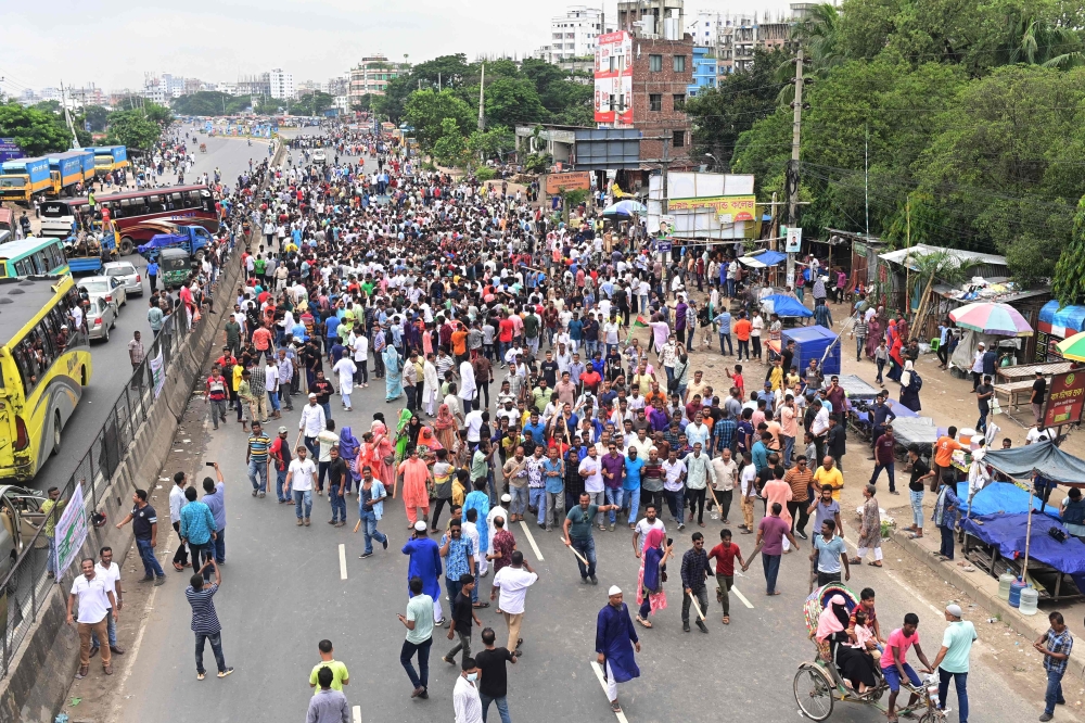 Bangladesh Nationalist party (BNP) activists block a highway entering Bangladesh's capital during a protest, in Dhaka on July 29, 2023. (Photo by Munir uz zaman / AFP)