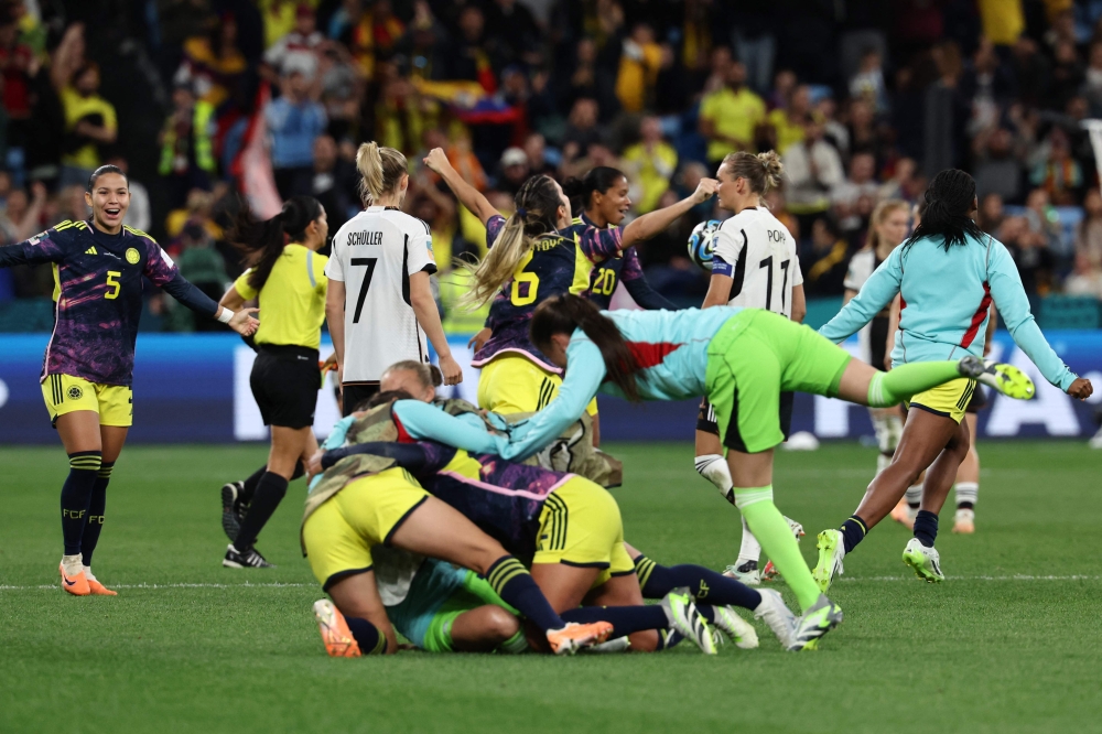Colombia players celebrate their victory after the final whistle of the Australia and New Zealand 2023 Women's World Cup Group H football match. (Photo by David Gray / AFP)