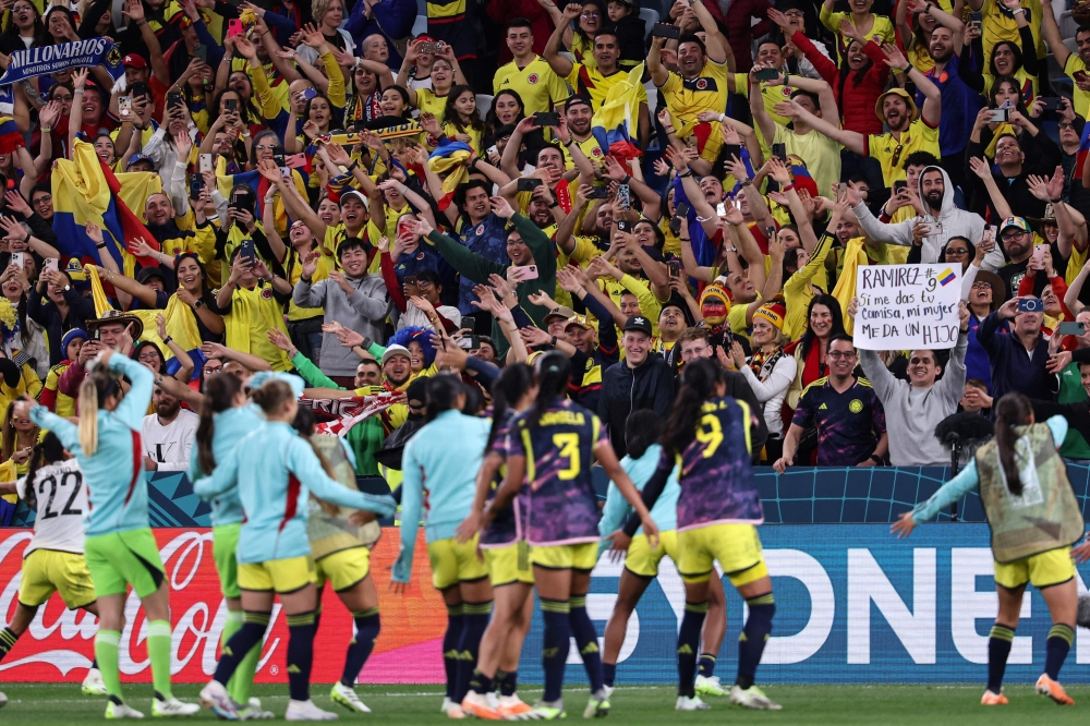 Colombia players celebrate with the fans in the stands at Sydney Football Stadium in Sydney on July 30, 2023. (Photo by DAVID GRAY / AFP)