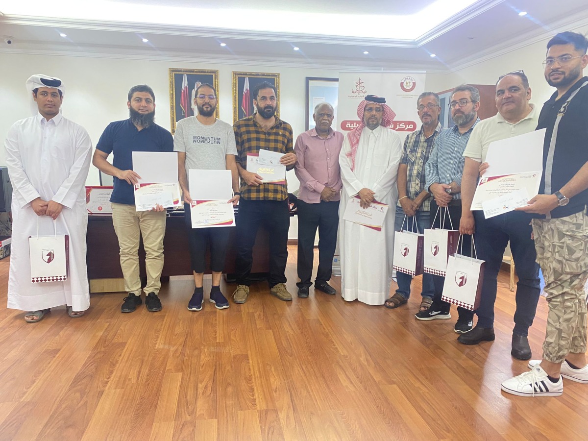 The award winners of the Al Jumailiyah Chess Championship pose for a photograph with officials.