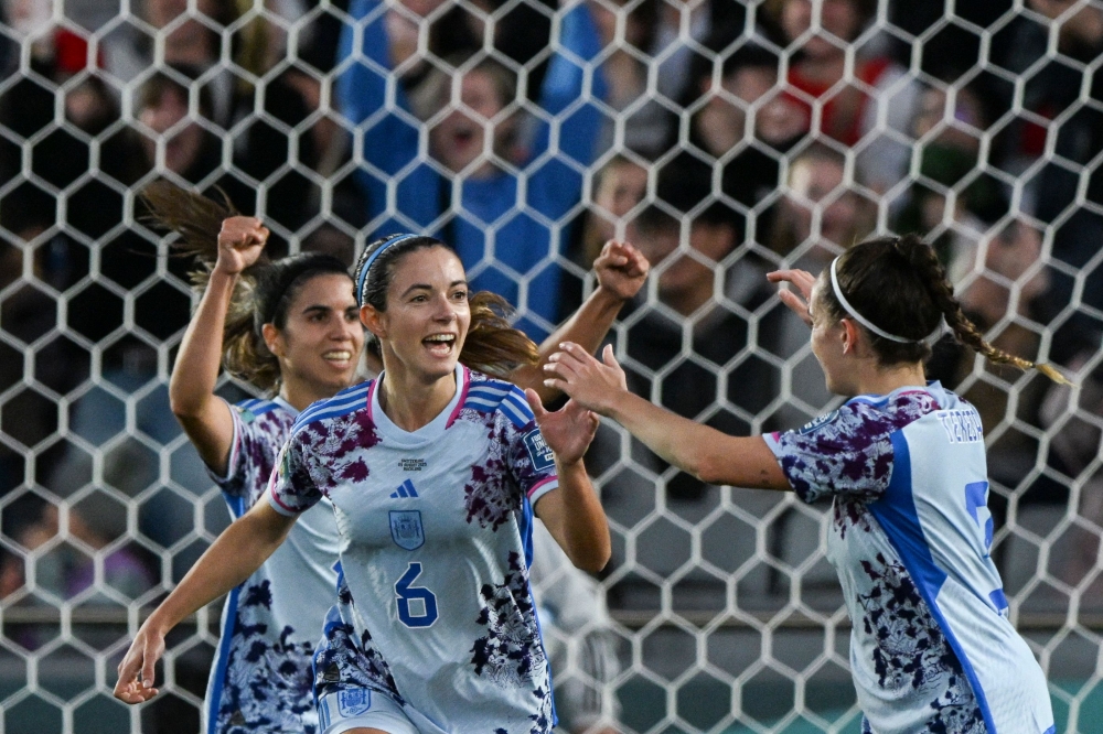 Spain's midfielder #06 Aitana Bonmati (2nd L) celebrates scoring her team's third goal at Eden Park in Auckland on August 5, 2023. (Photo by Saeed Khan / AFP)