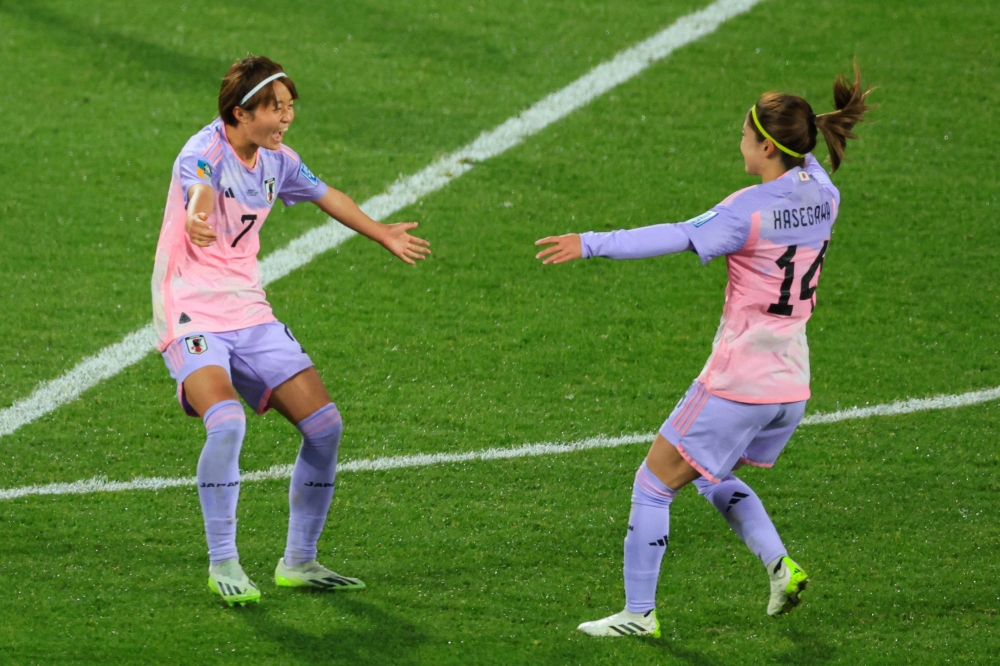 Japan's midfielder #07 Hinata Miyazawa (L) celebrates scoring her team's third goal at Wellington Regional Stadium in Wellington on August 5, 2023. (Photo by Grant Down / AFP)