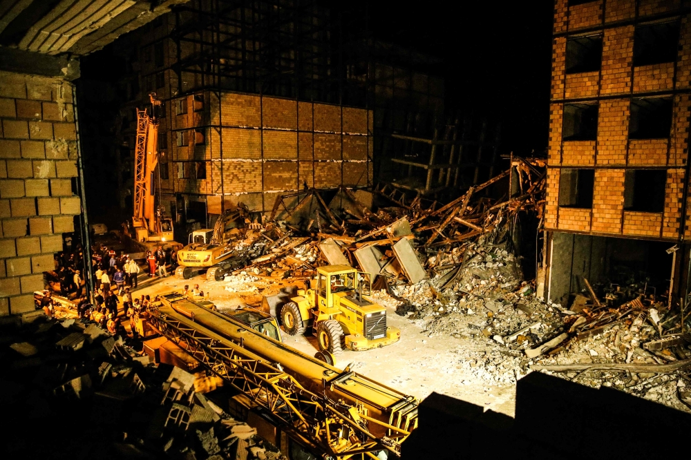 Rescue personnel gather at the site of a collapsed building in Tehran on August 6, 2023. Photo by TASNIM NEWS / AFP