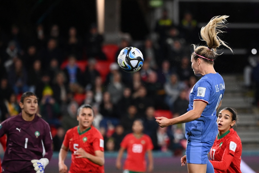 France's forward #09 Eugenie Le Sommer scores her team's fourth goal during the Australia and New Zealand 2023 Women's World Cup round of 16 football match between France and Morocco at Hindmarsh Stadium in Adelaide on August 8, 2023. (Photo by FRANCK FIFE / AFP)
