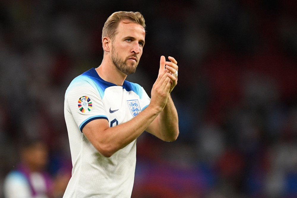 (Files) England's striker Harry Kane applauds fans on the pitch after the UEFA Euro 2024 group C qualification football match between England and North Macedonia at Old Trafford in Manchester, north west England, on June 19, 2023. (Photo by Oli Scarff / AFP) 