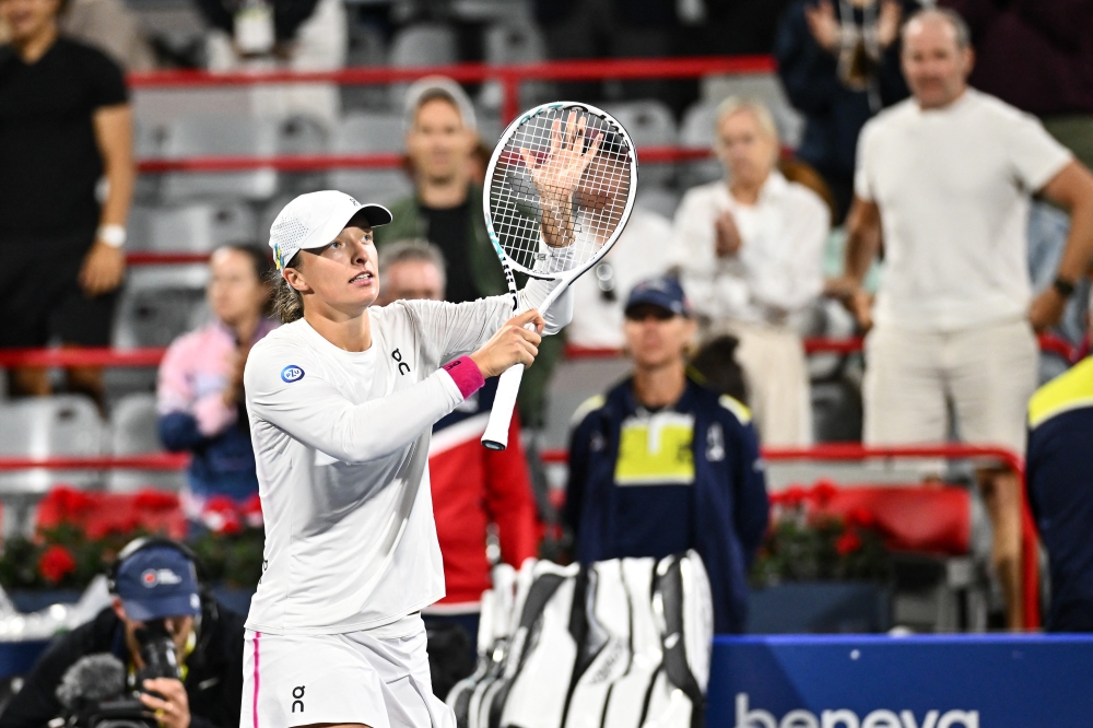 Iga Swiatek of Poland celebrates her 6-3, 4-6, 6-2 victory against Danielle Collins of the United States of America on Day 5. Minas Panagiotakis/Getty Images/AFP  