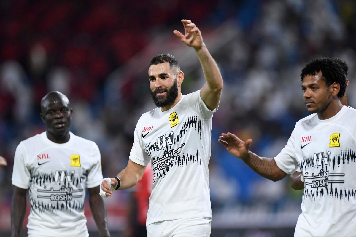  Karim Benzema celebrates with team mates after they won the Saudi Pro League football match between Al-Raed and Al-Ittihad at the King Abdullah Sports City stadium in Buraidah on August 14, 2023. (Photo by AFP)