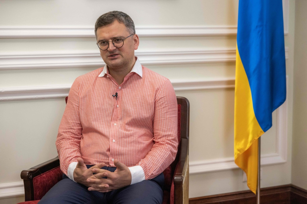 Ukrainian Foreign Minister Dmytro Kuleba speaks to a journalist during an interview with AFP, in Kyiv, on August 16, 2023. (Photo by Roman Pilipey / AFP)