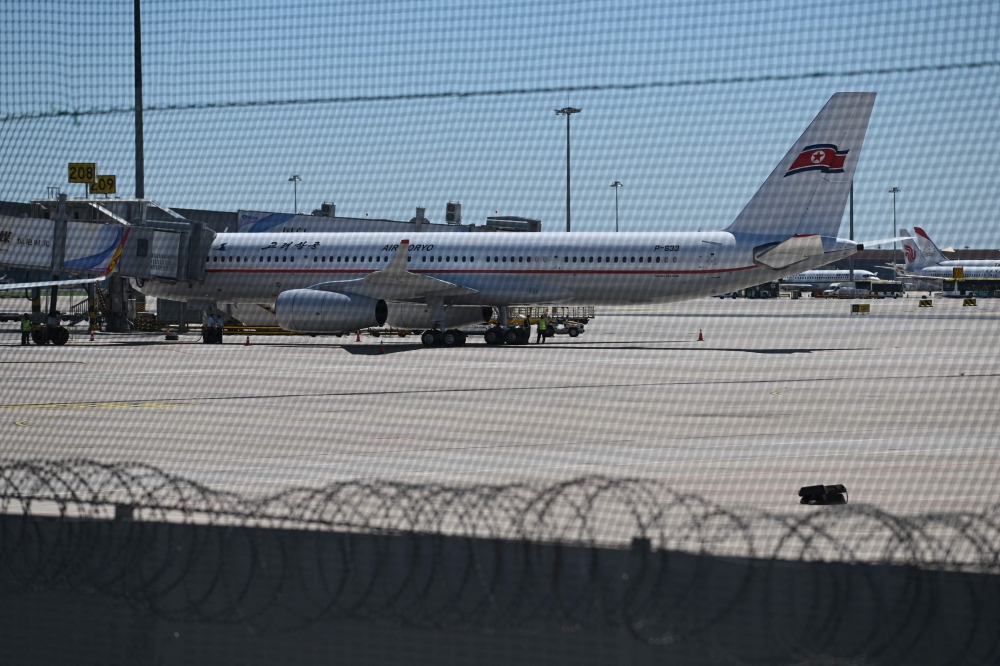 An Air Koryo plane is seen at Beijing Capital Airport on August 22, 2023. (Photo by Greg Baker / AFP)