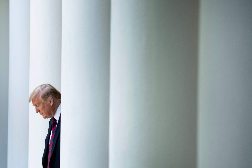 File photo: US President Donald Trump arrives to announce a new immigration proposal, in the Rose Garden of the White House in Washington, DC on May 16, 2019. (Photo by Brendan Smialowski / AFP)