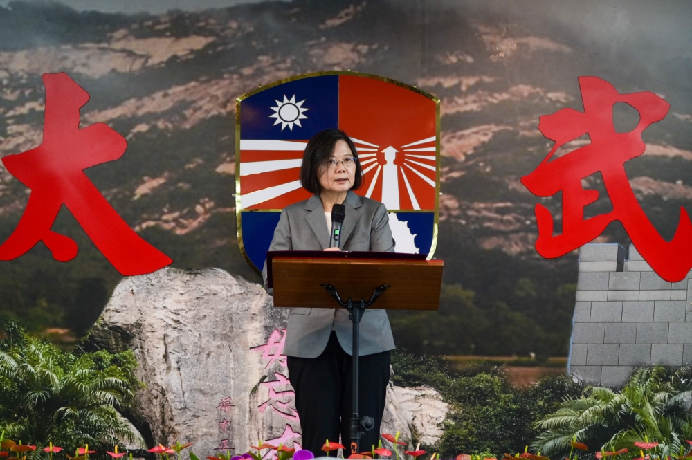Taiwan President Tsai Ing-wen speaks to the relatives of fallen soldiers during a lunch at a military base to mark the 65th anniversary of the Second Taiwan Strait Crisis in Kinmen on August 23, 2023. (Photo by Sam Yeh / AFP)