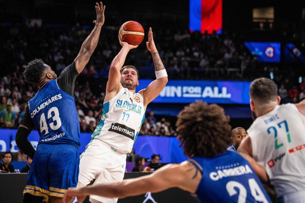 Slovenia's Luka Doncic shoots during the FIBA Basketball World Cup group F match between Slovenia and Venezuela at Okinawa Arena in Okinawa on August 26, 2023. (Photo by Yuichi YAMAZAKI / AFP)
